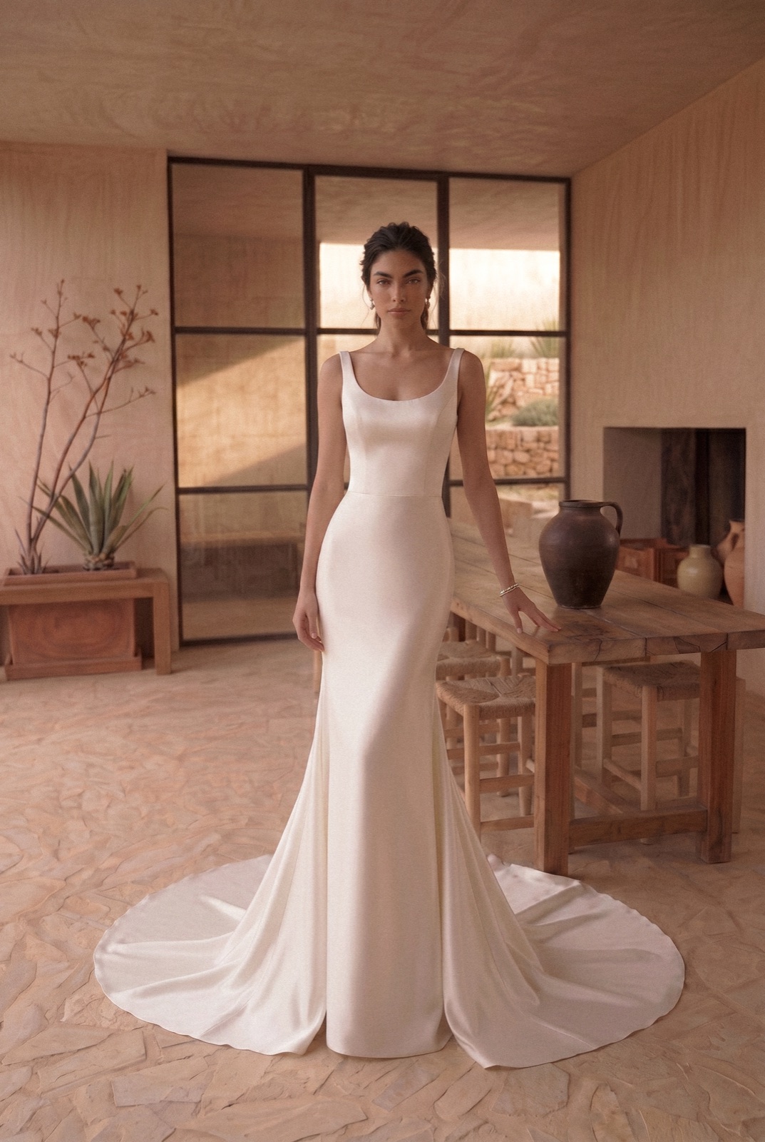 Model in a smooth dress in a warm natural interior