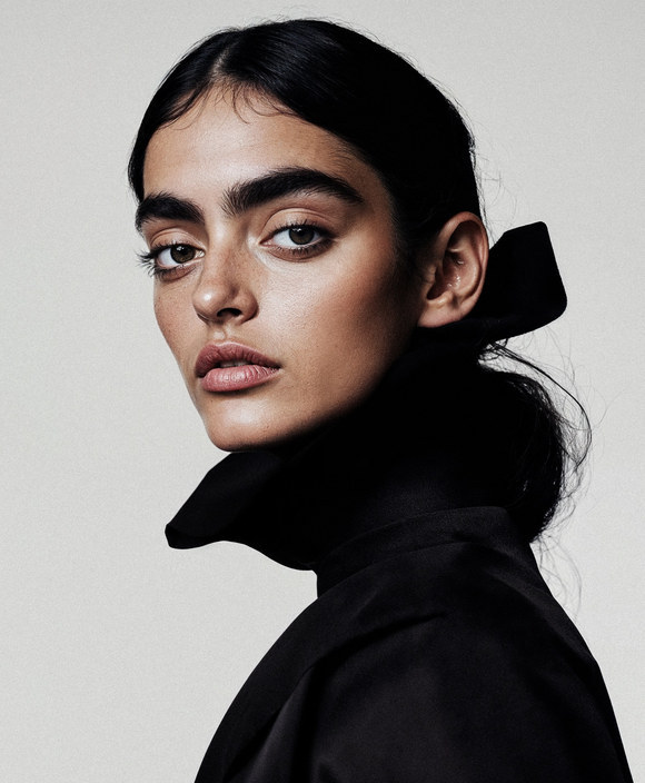 Colour portrait of a model in a dark top